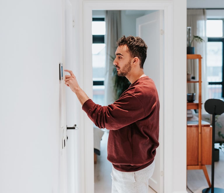 a man standing in front of a refrigerator