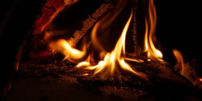 a fire burning in a dark room