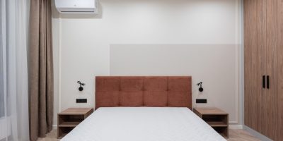 a bedroom with a bed in a room