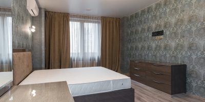 a bedroom with a large bed in a room