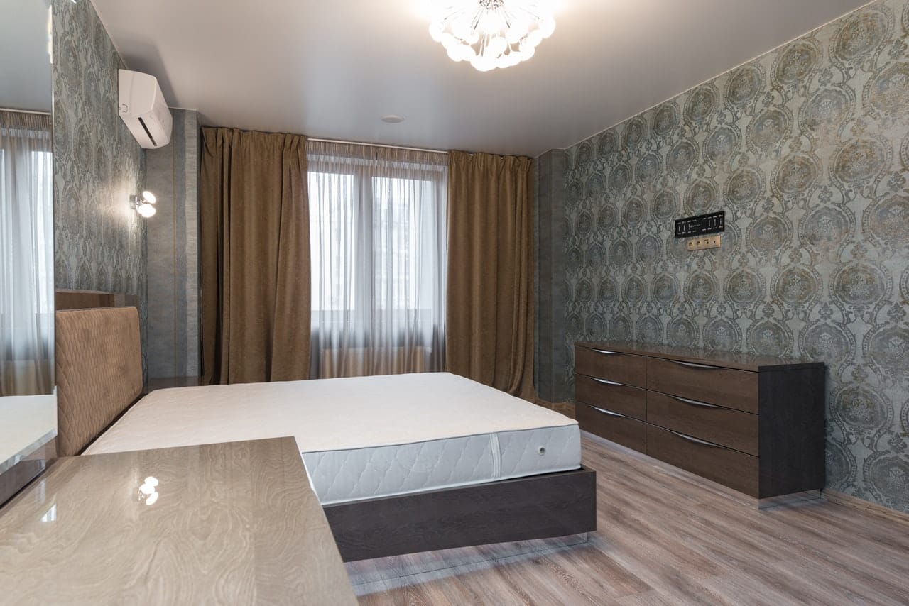 a bedroom with a large bed in a room