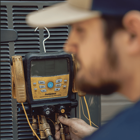 mainline hvac tech repairing unit