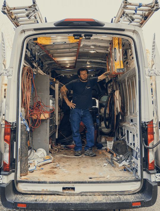 mainline hvac tech in truck
